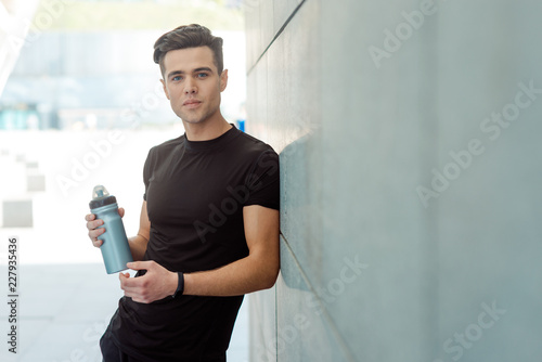 Man holding bottle of water