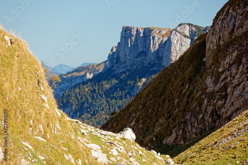 Cliffs above the Sealpsee from pass above the Berggasthaus Mesmer, Alpstein - Apenzell, Switzerland photo