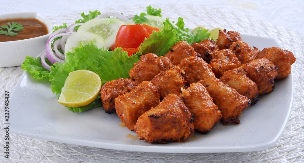 Chicken Boti Kebab, Delicious spicy and marinated boneless chicken meat cooked on charcoal flame. Chicken Boti Kebab, Delicious spicy and marinated boneless chicken meat cooked on charcoal flame.