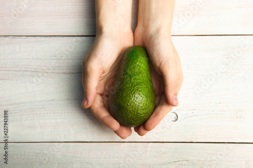 Ripe avocado in hand