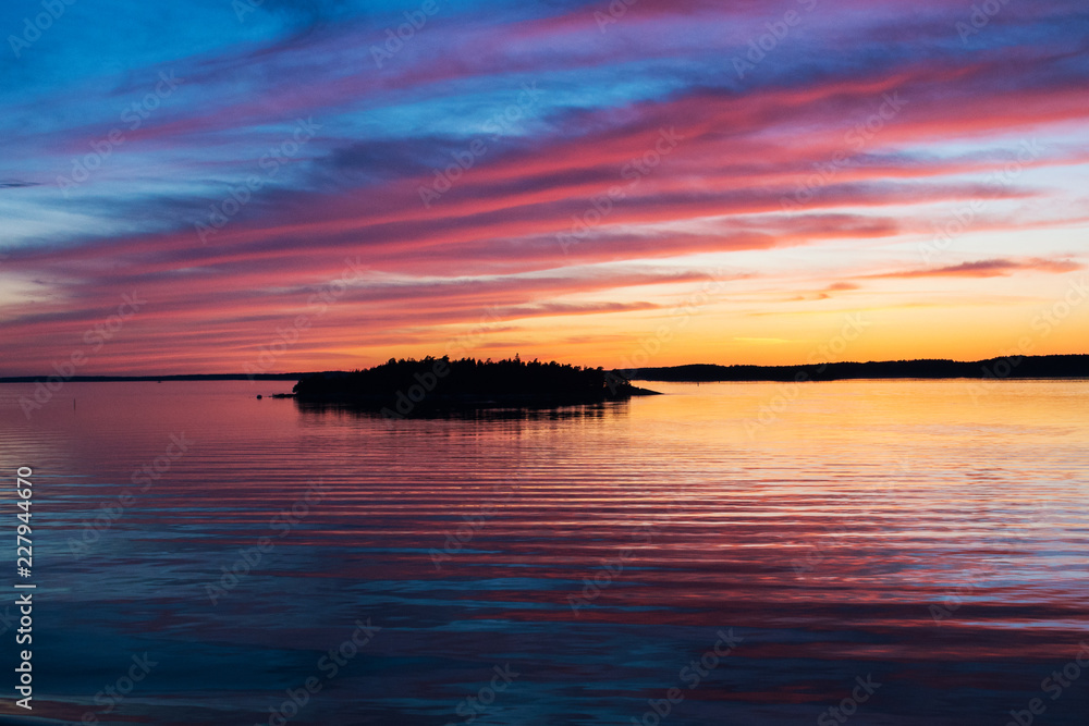 Fototapeta premium A natural Dramatic, blazing sunset in the Baltic sea. Bright sky and clouds. beautiful seascape as background