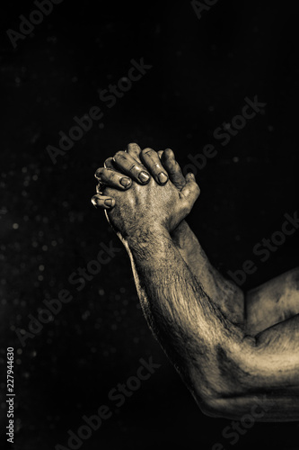 Close-up of a mans arm. Low key shoot.