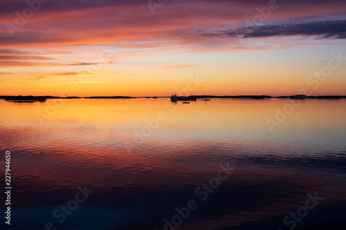 A natural  Dramatic   blazing   sunset in the Baltic sea. Bright sky and clouds. beautiful seascape as background