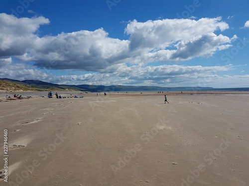 Beach landscape scene in Talybont, North Wales on a summer day. photo