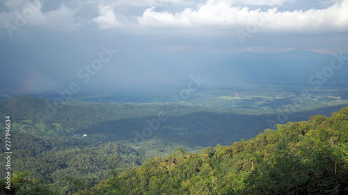 Landscape Mountain valley. Background blue sky with white full of rain clouds. © santipong