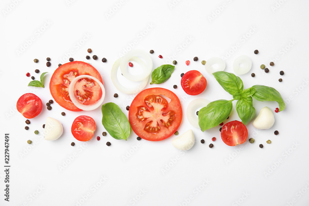 Fototapeta Fresh green basil leaves, tomatoes and mozzarella on white background, top view