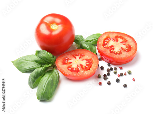 Fresh green basil leaves, tomatoes and pepper on white background