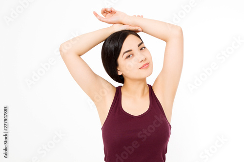 Skin care and armpit concept. Make up and cosmetics. Young asian woman isolated on white background in summer shirt. Copy space. © ladyalex