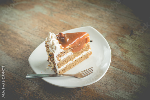 layer cake with coffee flavor and caramel syrup in cafe(vintafe color) photo