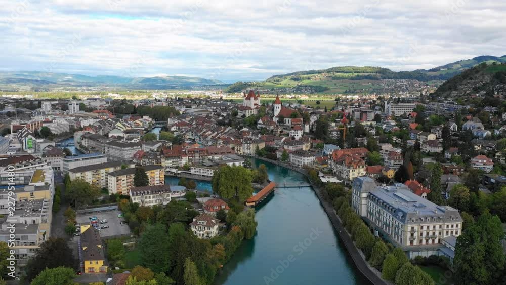 Aerial panoramic view of cityscape of Thun, picturesque town on river Aare, Thun Castle - landscape panorama of canton of Bern from above, Switzerland, Europe Aerial panoramic view of cityscape of Thun, picturesque town on river Aare, Thun Castle - landscape panorama of canton of Bern from above, Switzerland, Europe
