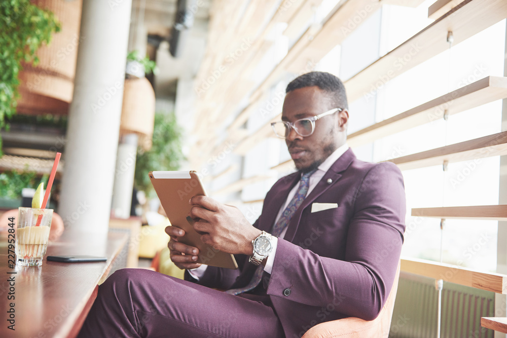 A beautiful young African American who thinks about a serious idea. Confident in making business decisions A beautiful young African American who thinks about a serious idea. Confident in making business decisions