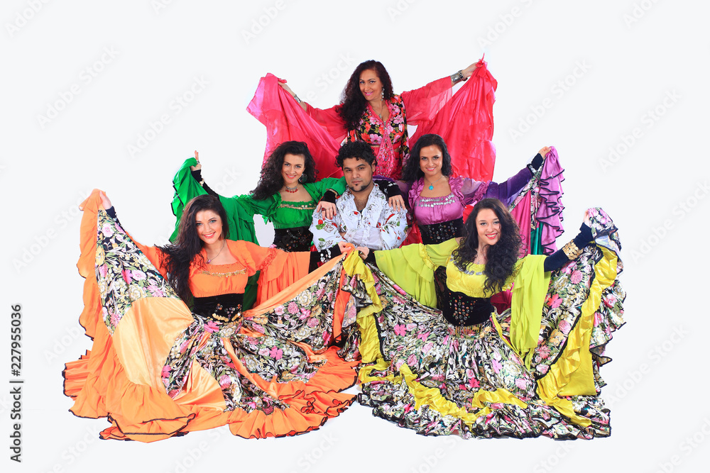 professional Gypsy dancing group in national costumes performing folk dance.