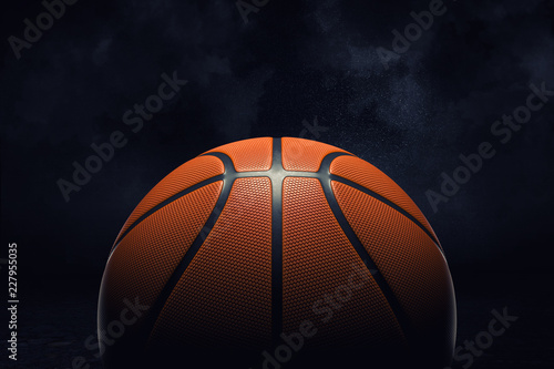 3d rendering of an orange rubber surface of a basketball ball shown on a black background. © gearstd