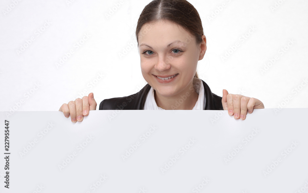 young woman employee of the company holding a blank banner young woman employee of the company holding a blank banner