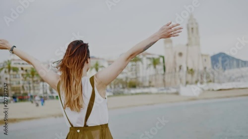 Beautiful young woman relaxing near the sea. Sitges, Spain photo