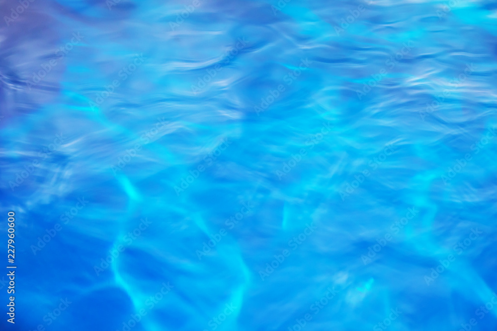 The smooth natural blue water background with bokeh abstract on the sea or ocean,vintage and soft colored blur. The smooth natural blue water background with bokeh abstract on the sea or ocean,vintage and soft colored blur.