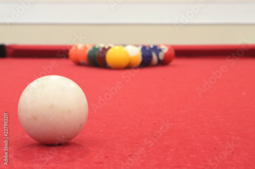 Billiards table with Cue ball in focus