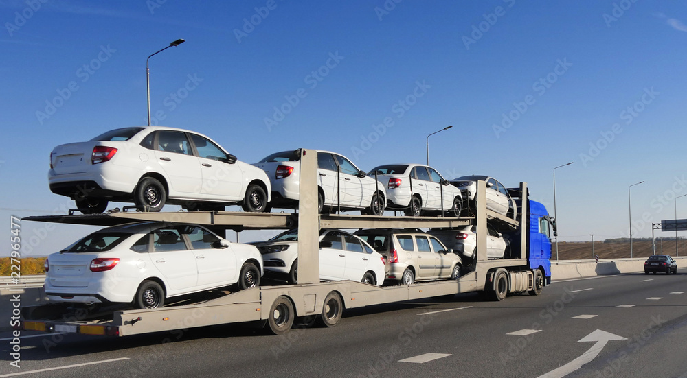 The trailer is engaged in the delivery of new cars to their place of sales The trailer is engaged in the delivery of new cars to their place of sales