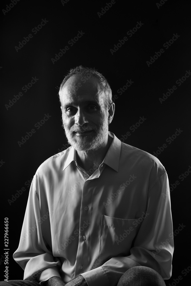 Obraz premium portrait of a middle aged man on black