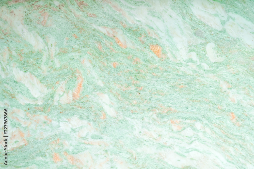 green marble texture. A closed up details of marble floor pattern in green and orange texture for background.