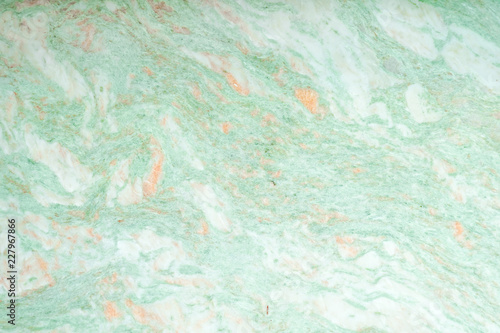 green marble texture. A closed up details of marble floor pattern in green and orange texture for background.