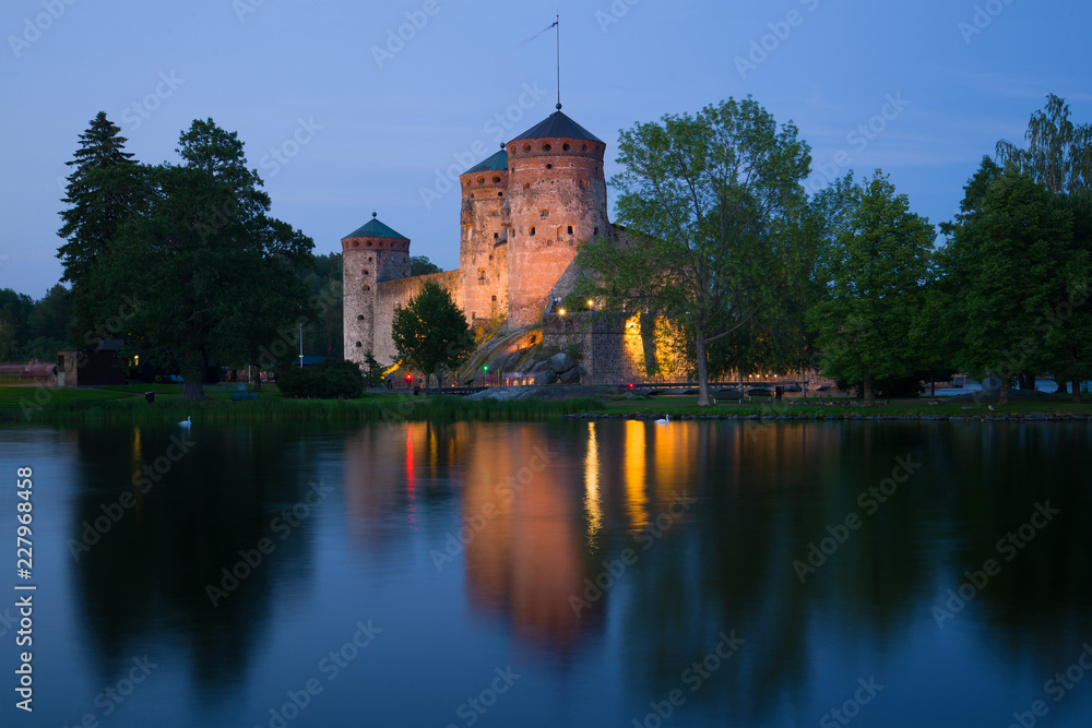 The ancient Olavinlinna fortress in July twilight. Savonlinna, Finland