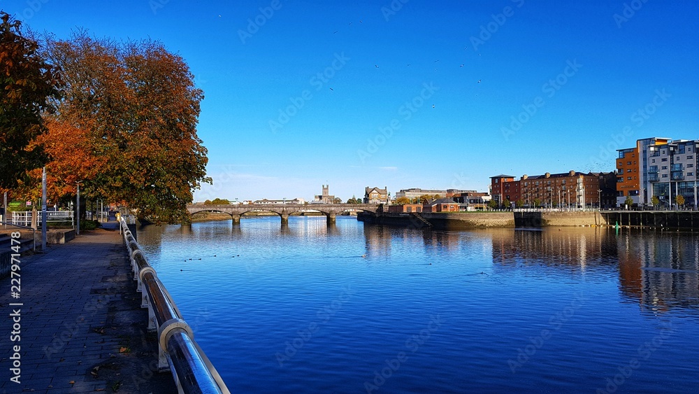 limerick city skyline ireland. beautiful limerick urban cityscape over the river shannon on a sunny day with blue skies.