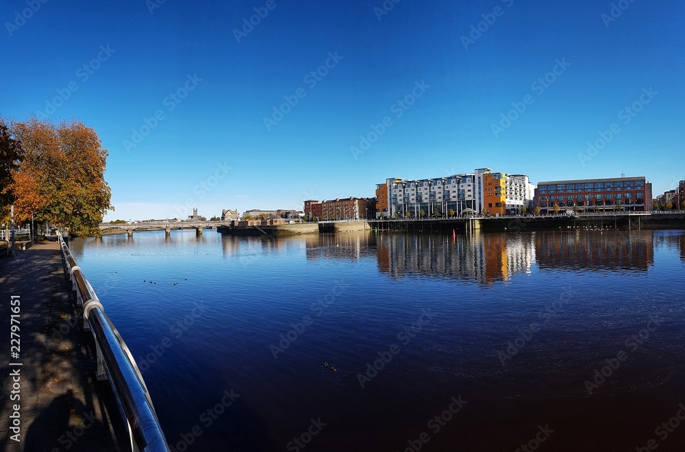 limerick city skyline ireland. beautiful limerick urban cityscape over the river shannon on a sunny day with blue skies.