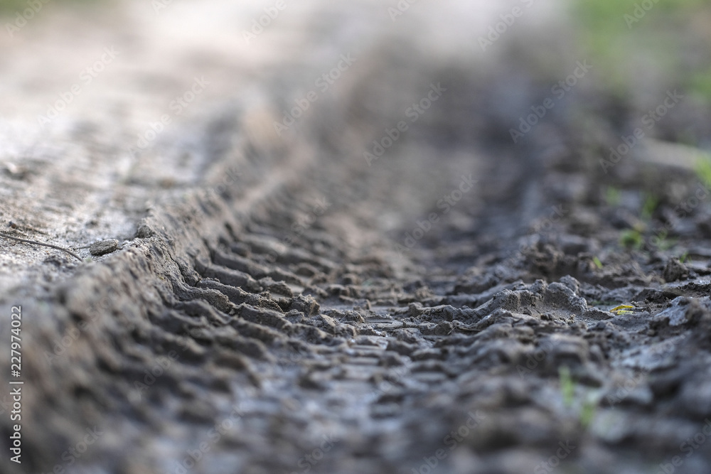 Car or truck trace on a country road Car or truck trace on a country road