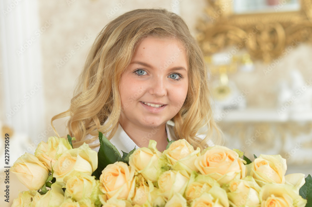 Portrait of a cute curly teen girl posing