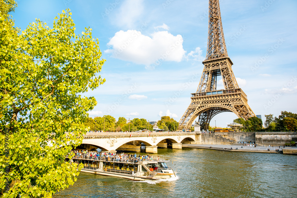 Obraz premium View on the Eiffel tower on Seine river during the daylight in Paris