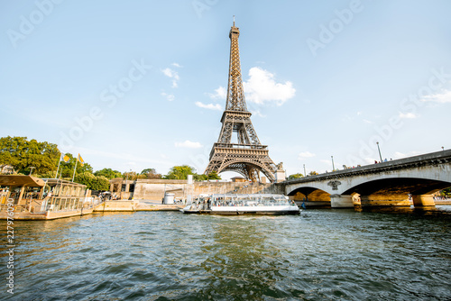 View from the boat on the Eiffel tower on Seine river during the sunset in Paris