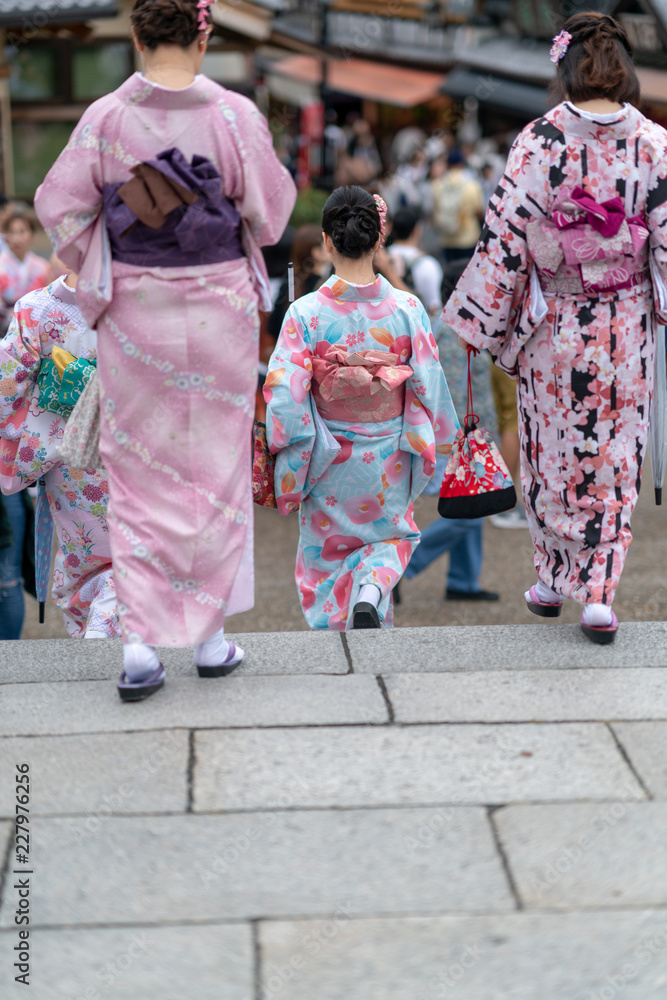 Girls in geisha costume taking a selfie