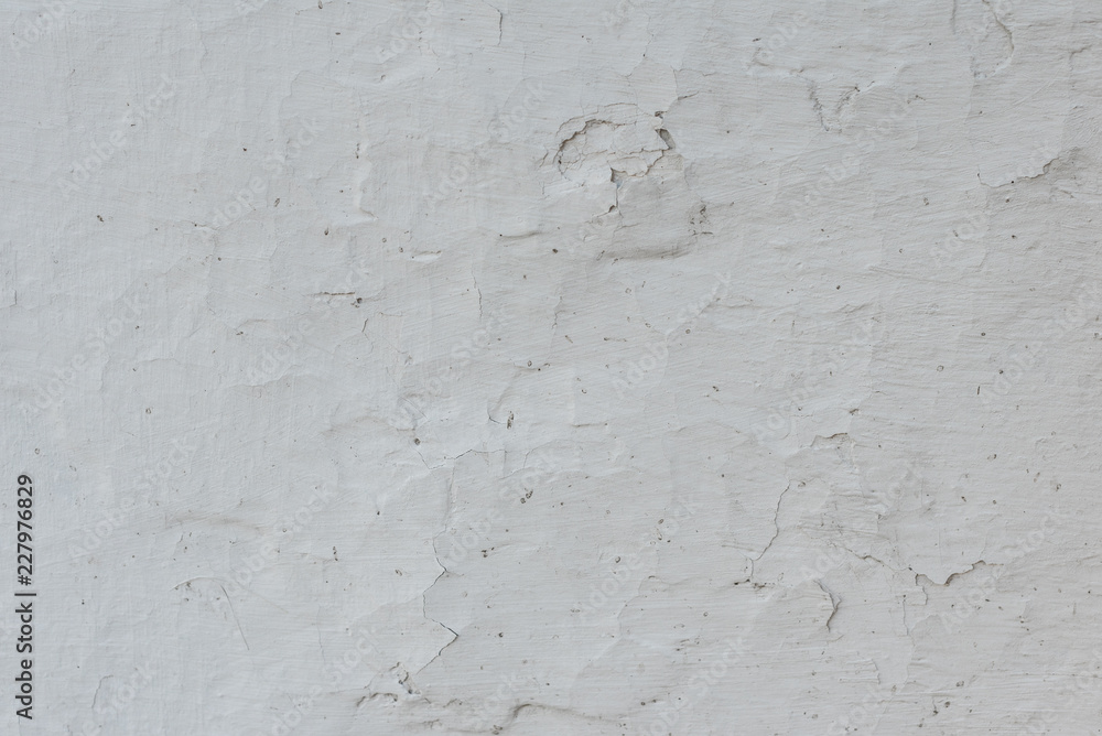 Wall fragment with scratches and cracks. It can be used as a background Wall fragment with scratches and cracks. It can be used as a background