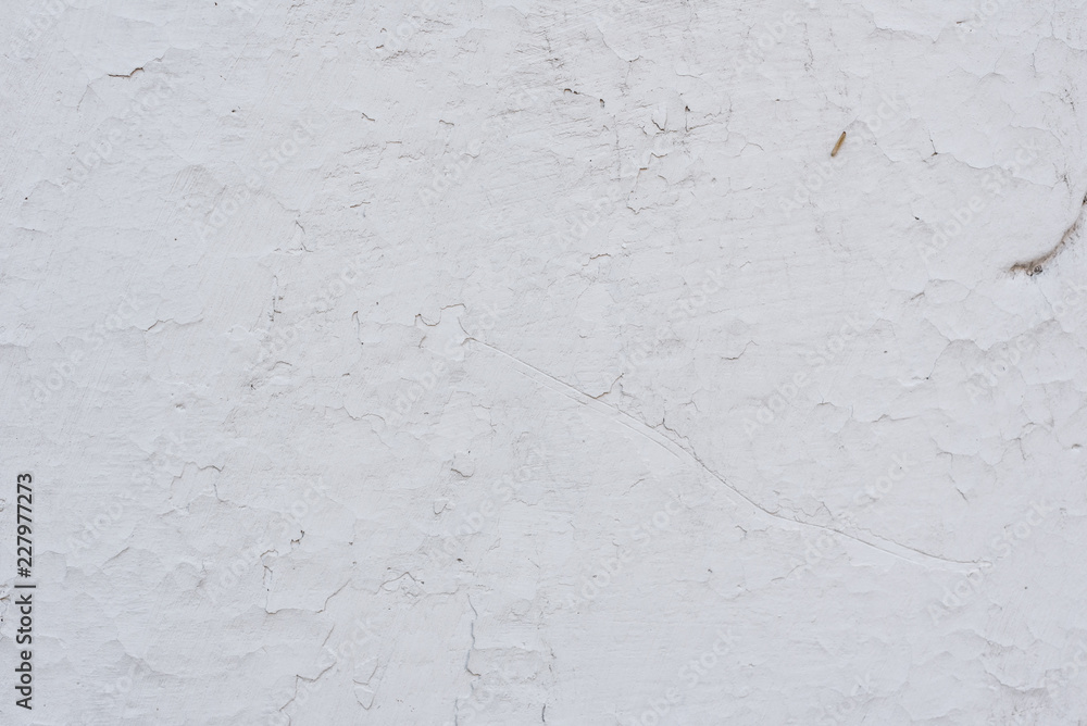 Wall fragment with scratches and cracks. It can be used as a background Wall fragment with scratches and cracks. It can be used as a background