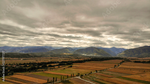 Aerial view of beautiful Transylvania. Carpathian mountains in autumn, sunset with beautiful collors and clouds.