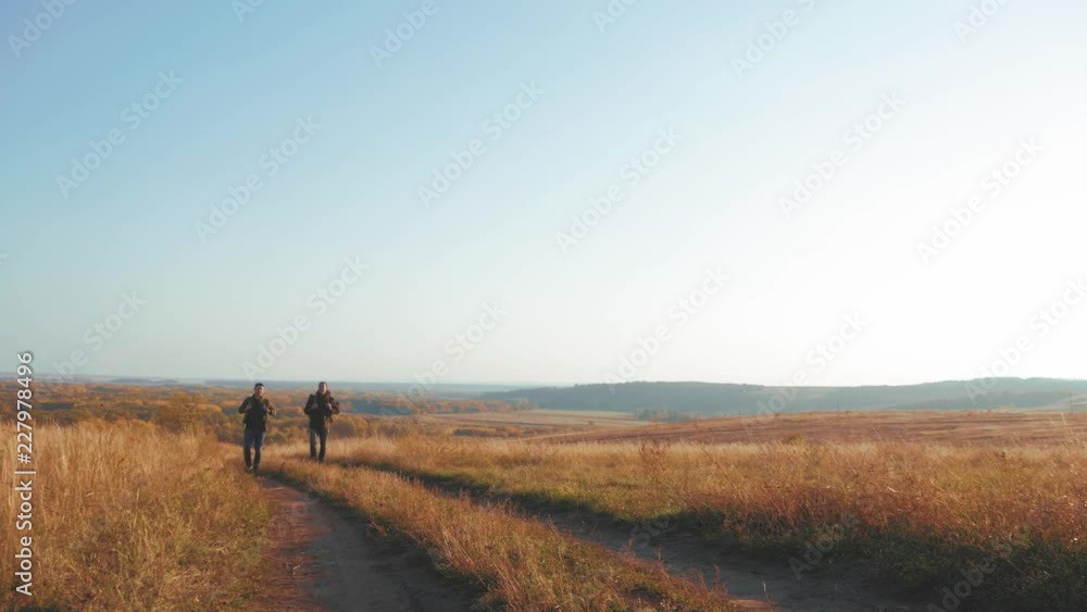Male backpackers hiking in mountain adventure. Hiker couple travel enjoy life scenic nature landscape. Summer vacation adventure. People living healthy active lifestyle outdoors. Travel concept. Male backpackers hiking in mountain adventure. Hiker couple travel enjoy life scenic nature landscape. Summer vacation adventure. People living healthy active lifestyle outdoors. Travel concept.