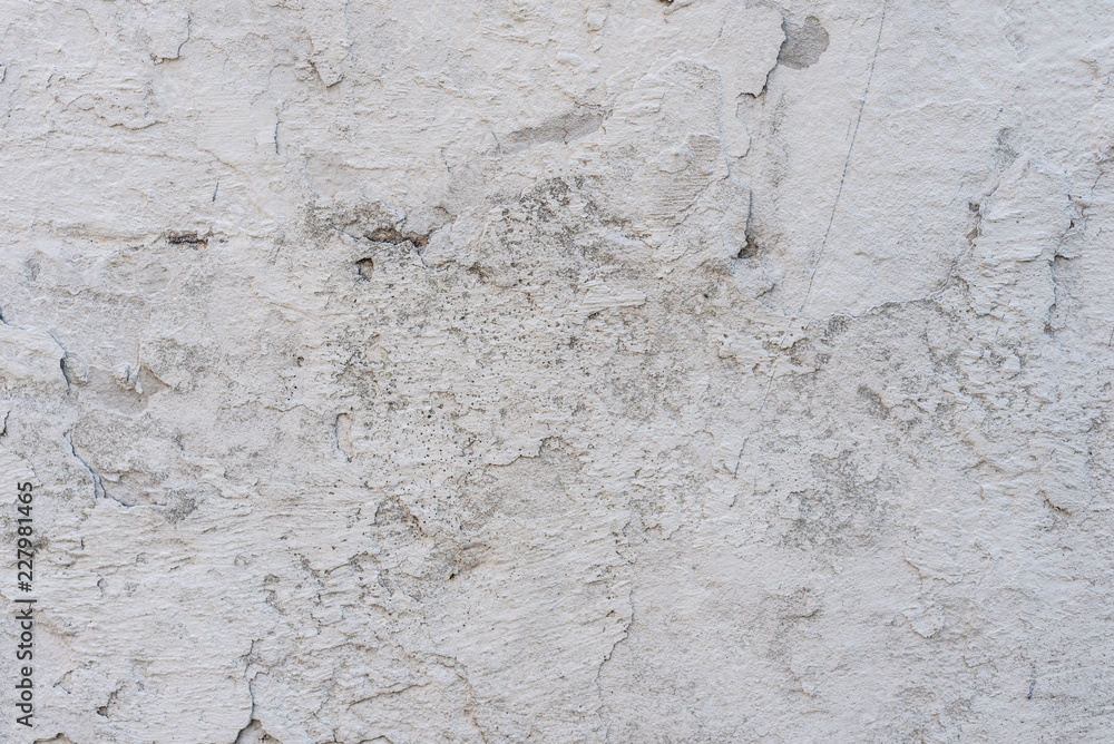 Wall fragment with scratches and cracks. It can be used as a background Wall fragment with scratches and cracks. It can be used as a background