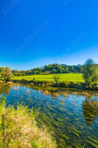 Croatian rivers, valley of Dobra and old fortress in Novigrad, green countryside landscape Karlovac county 