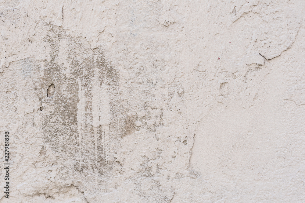 Wall fragment with scratches and cracks. It can be used as a background Wall fragment with scratches and cracks. It can be used as a background