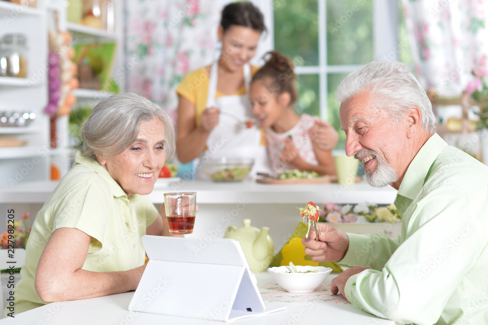 Portrait of a senior couple drinking tea at kitchen