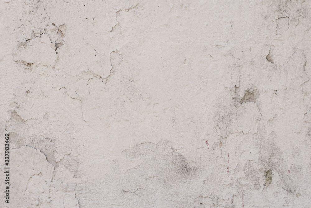 Fototapeta premium Wall fragment with scratches and cracks. It can be used as a background