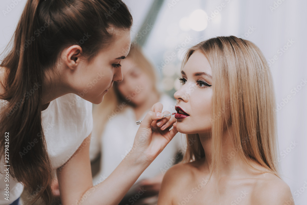 Makeup Artist Doing Makeup Blond Girl in Salon. Makeup Artist Doing Makeup Blond Girl in Salon.