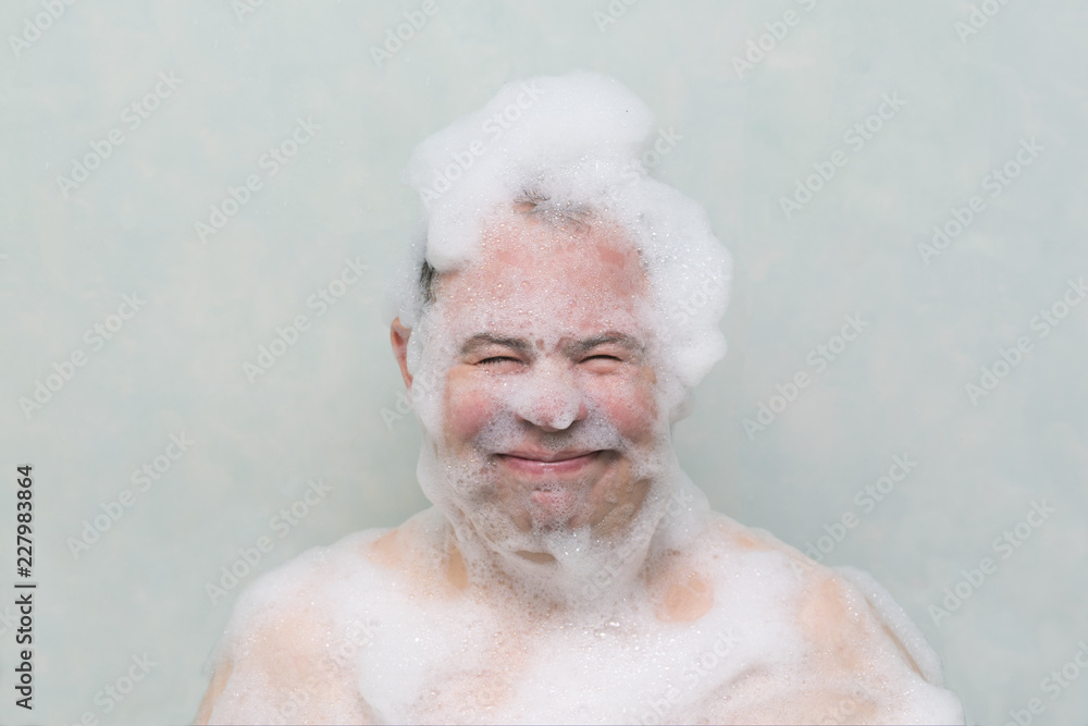 the guy washes in the bathroom with his head in the lather the guy washes in the bathroom with his head in the lather
