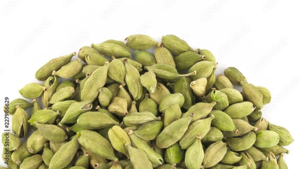 Half frame or circle shaped caraway seeds heap in top left corner. Horizontally rotating on the turntable. Isolated on the white background. Close up. Macro. Copy Space. Half frame or circle shaped caraway seeds heap in top left corner. Horizontally rotating on the turntable. Isolated on the white background. Close up. Macro. Copy Space.