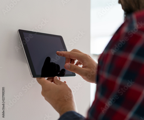 Man using smart home device