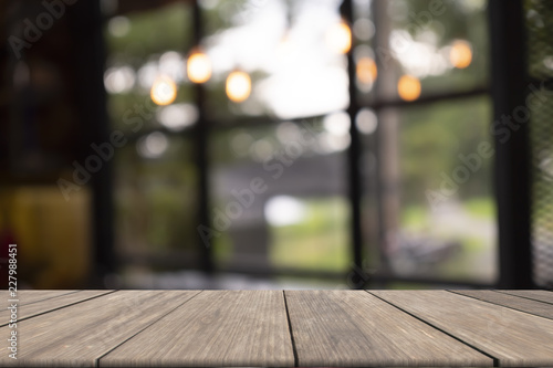 Wooden table on front blurred background