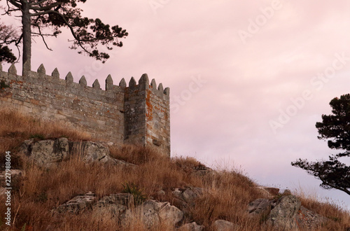 murallas medievales del castillo de Baiona en Galicia al atardecer photo