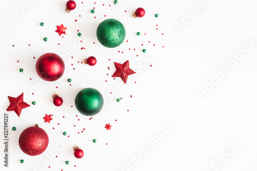 Christmas composition. Christmas red and green decorations on white background. Flat lay, top view, copy space photo