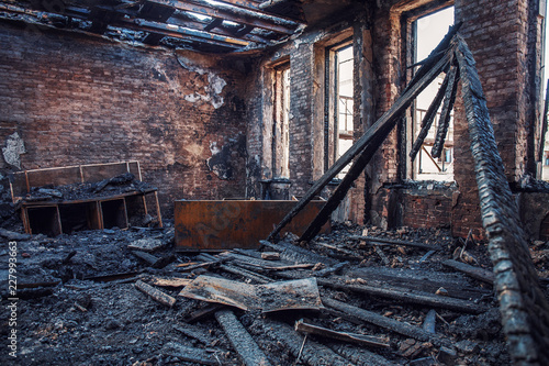 Fototapeta Naklejka Na Ścianę i Meble -  Burned house interior after fire, ruined building room inside, disaster or war aftermath